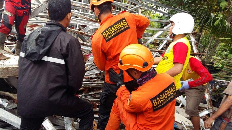 Rescue team members attempting to clear debris after a tsunami hit at Banten province, Indonesia, December 23, 2018