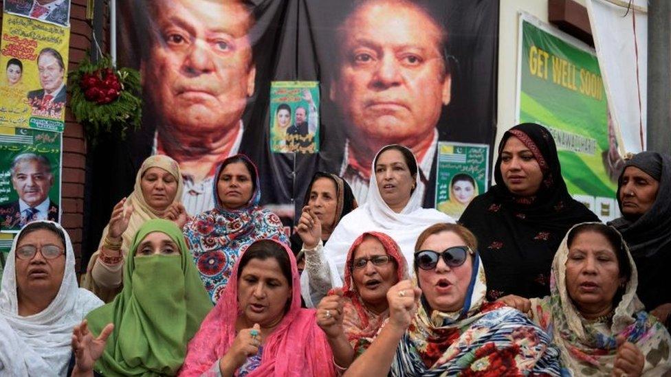 Supporters pray outside a hospital where Sharif was being treated in October