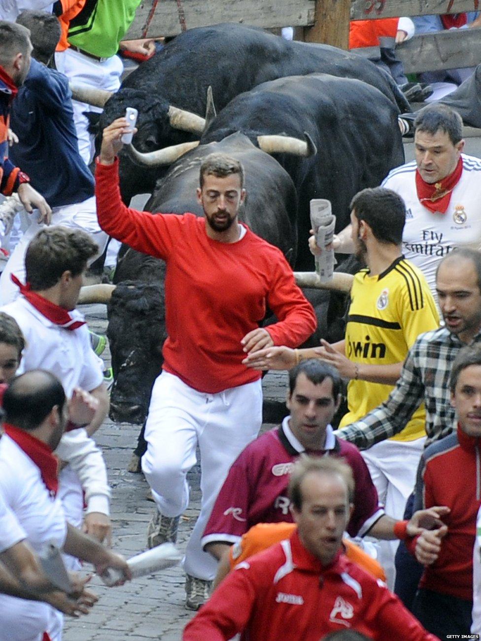 People at the running of the bulls in Pamplona, Spain, in 2014