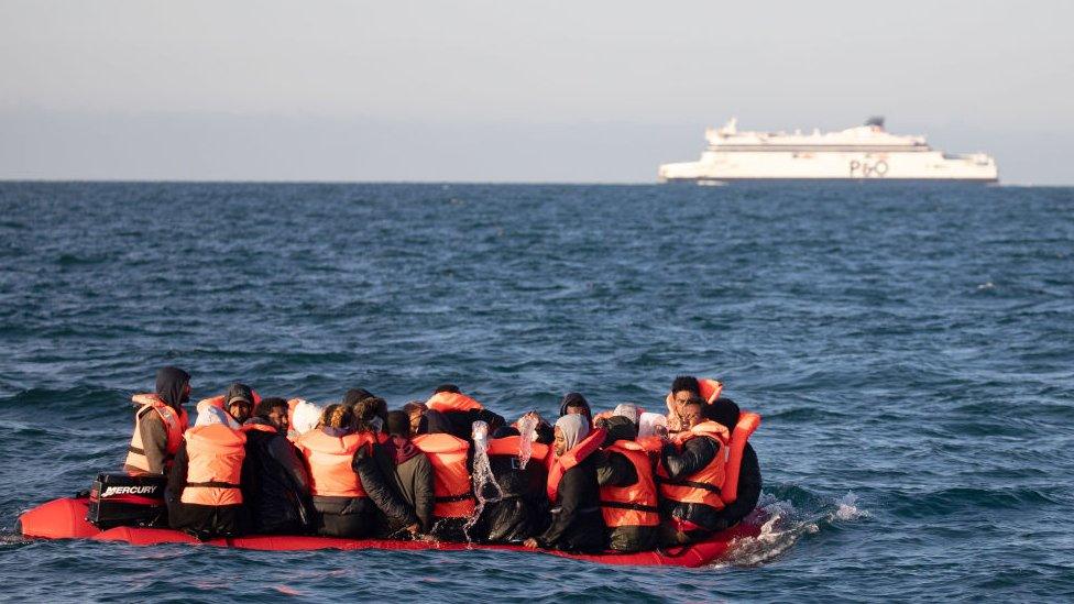 A small boat crosses the English Channel