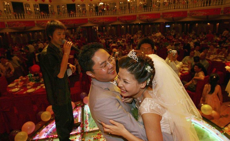 A couple dance at their wedding banquet