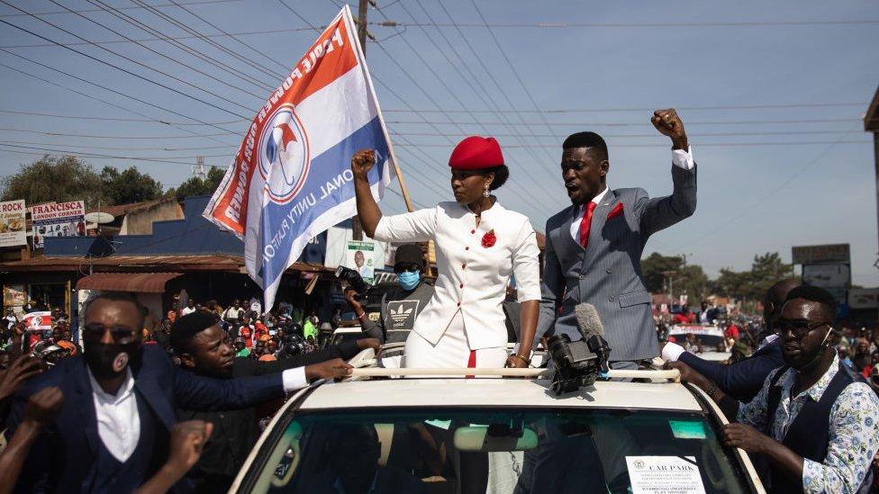 Bobi Wine parades though the streets through crowds of supporters