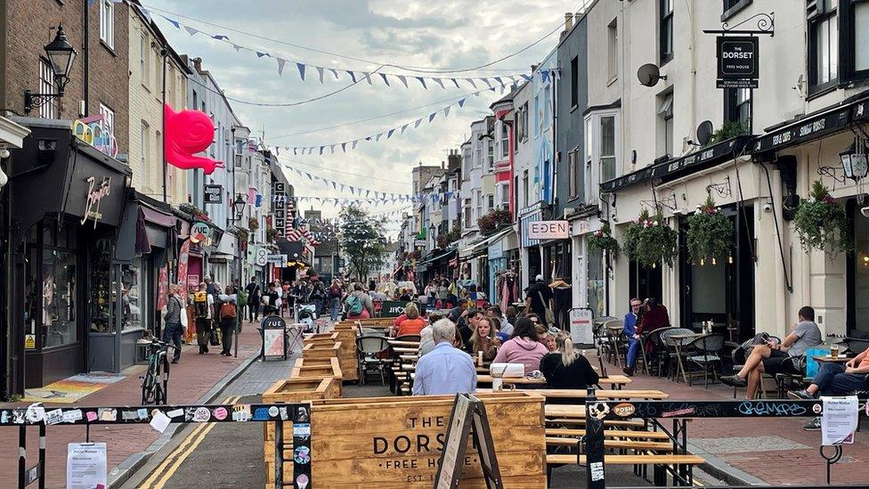 Gardnet Street, closed off to traffic and full of outside tables