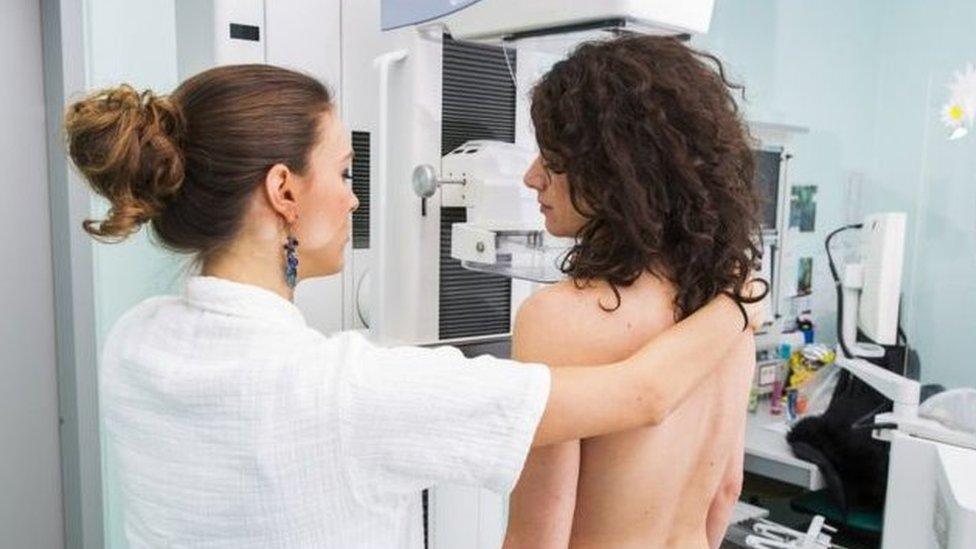 Woman having mammogram