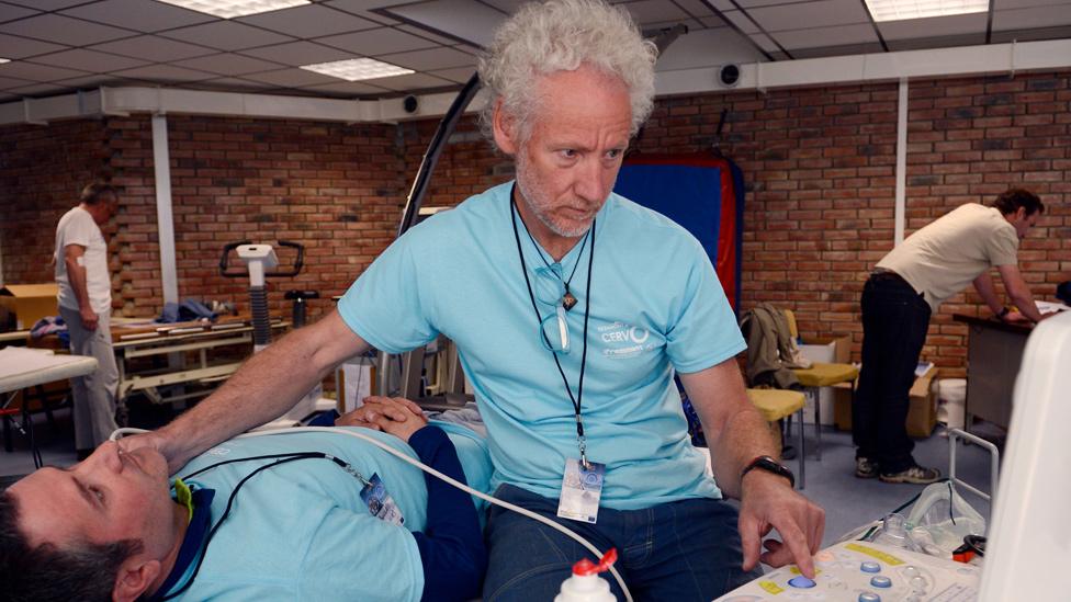 Doctor Emmanuel Cauchy doing checks on a patient in Chamonix, 17 Apr 13