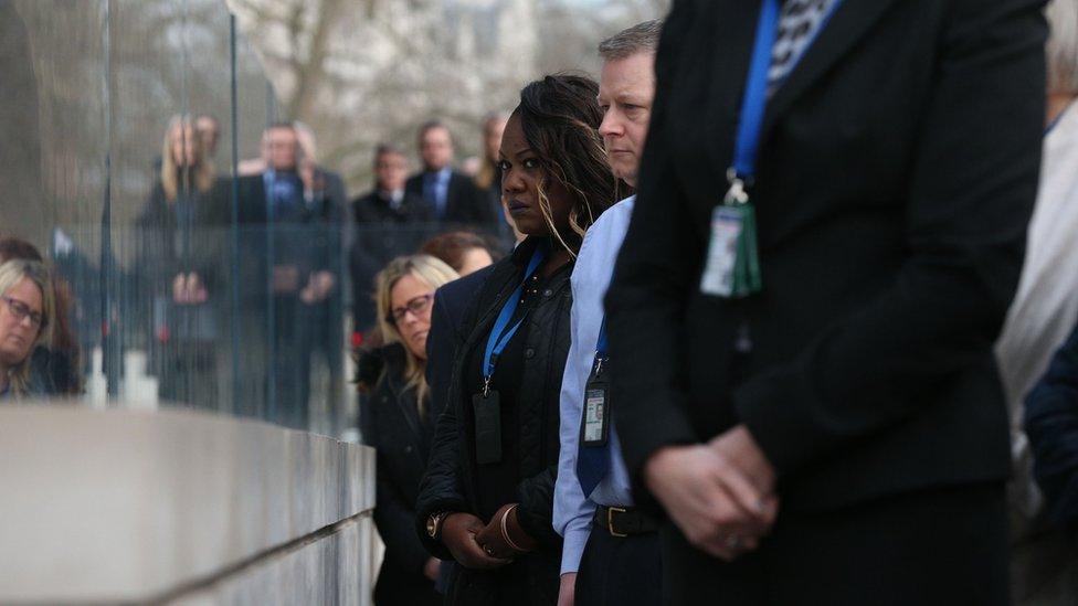 A minute's silence is observed outside New Scotland Yard