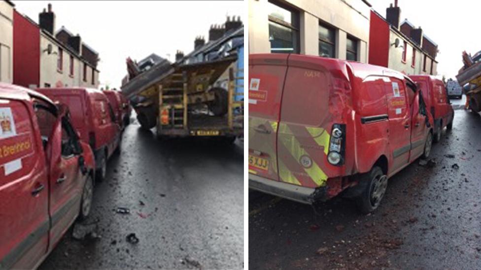 Damaged Royal Mail vans after a digger fell on them