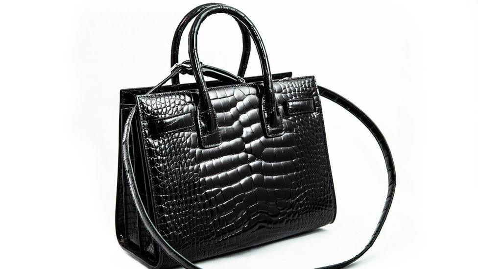 An alligator handbag.