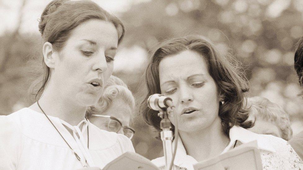 Betty Williams and Mairead Corrigan recite the Peace Pledge to thousands of supporters in Woodvale Park.