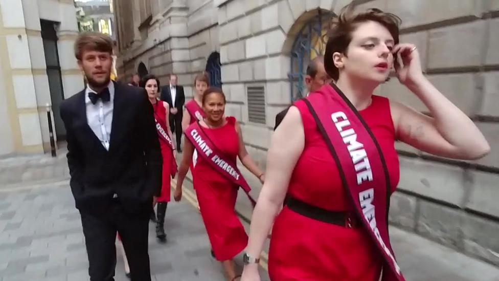 Climate change protesters on their way into Mansion House