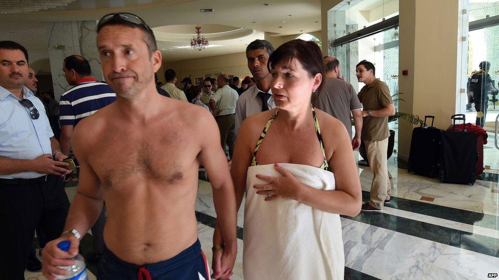 Tourists react in the Imperial hotel at the resort town of Sousse