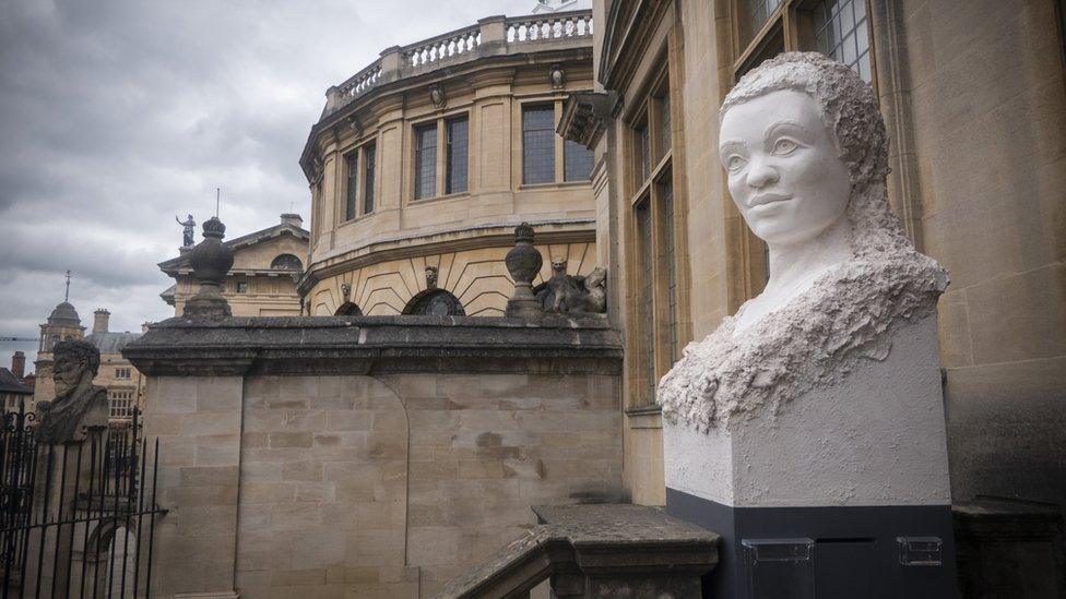 Stone head on a plinth