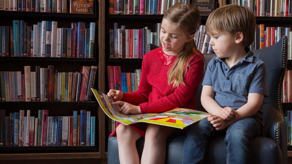 Children reading in Storyhouse Library, Chester