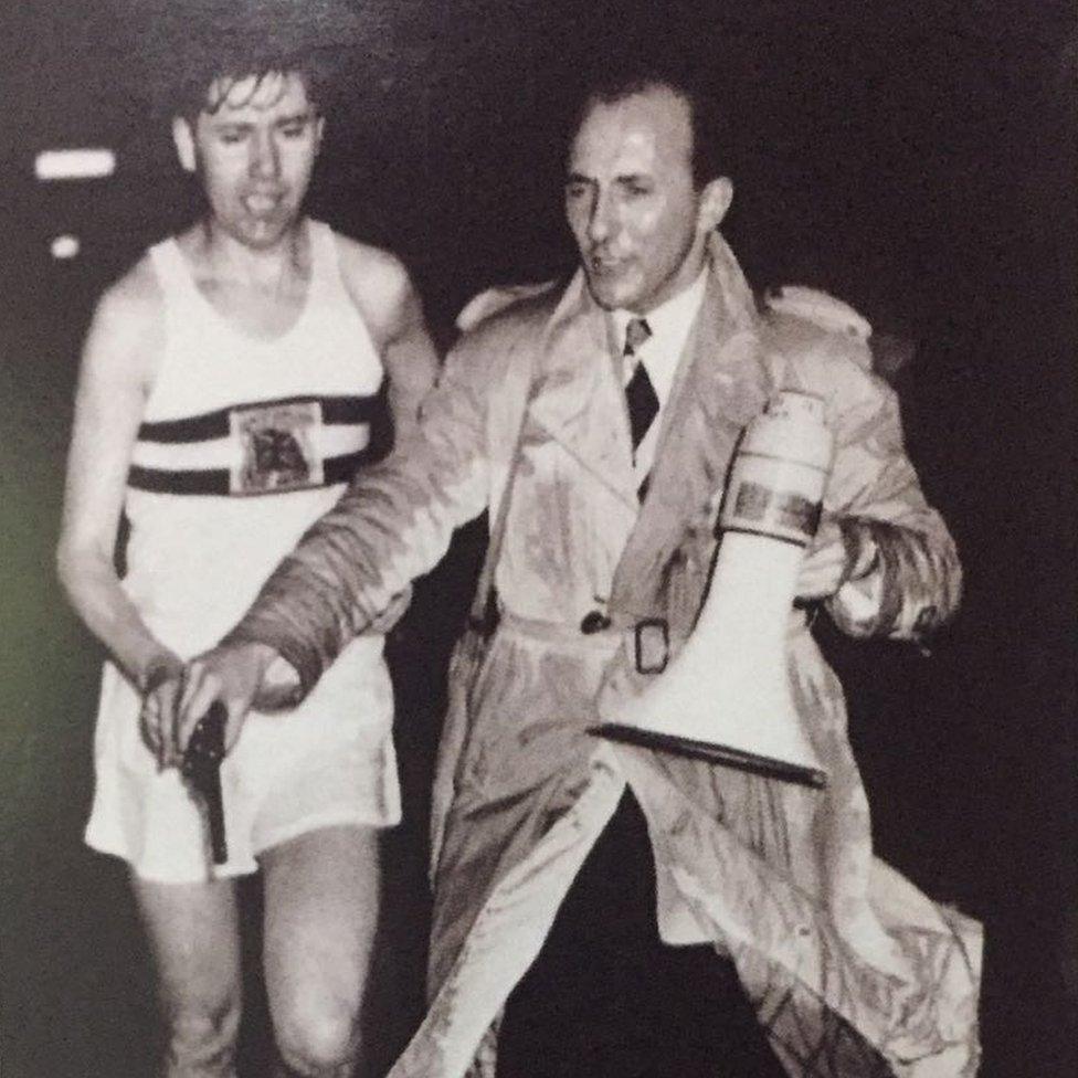 A rain drenched Bernard Baldwin helps a Nos Galan mystery runner start