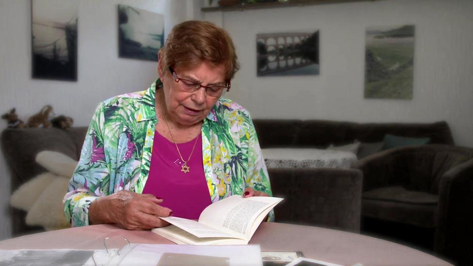 Ruth at home, wearing the star of David