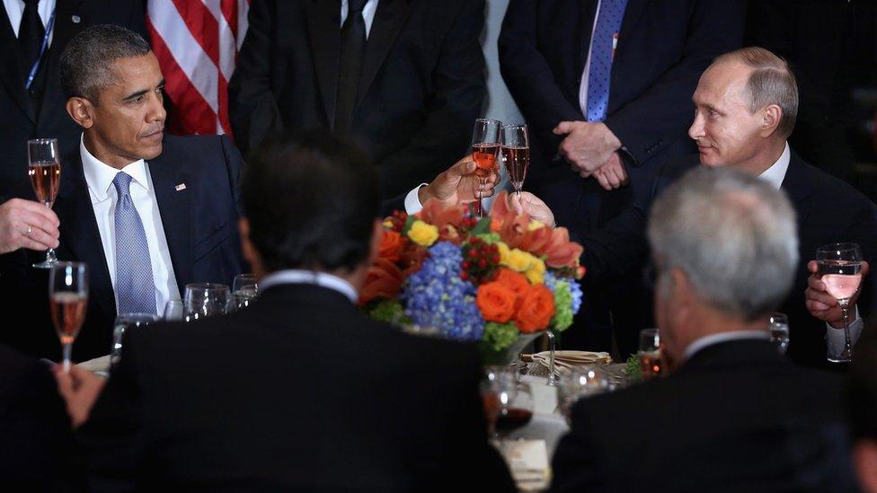 US President Barack Obama (L) and Russian President Vladimir Putin (R) share a toast at the United Nations headquarters in New York - 28 September 2015.