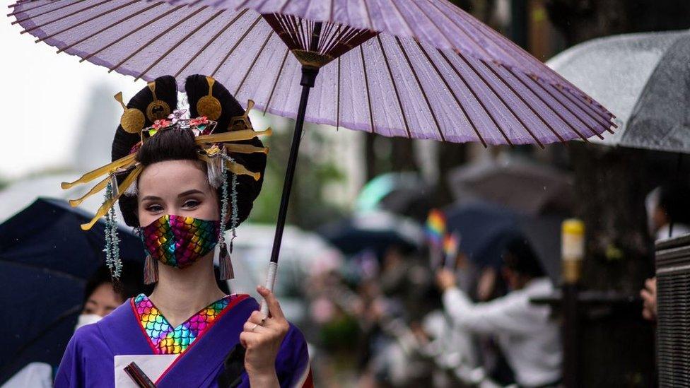 Woman in traditional Japanese attire attends Tokyo prime march