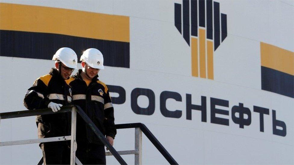 Workers and Rosneft logo