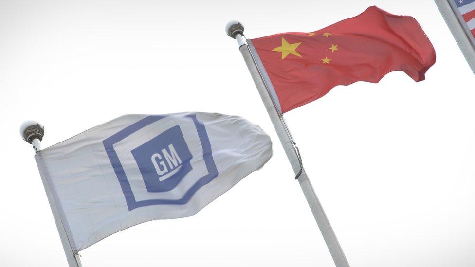 GM flag alongside China flag