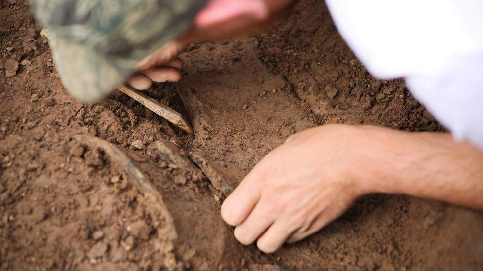 Man digging in the ground