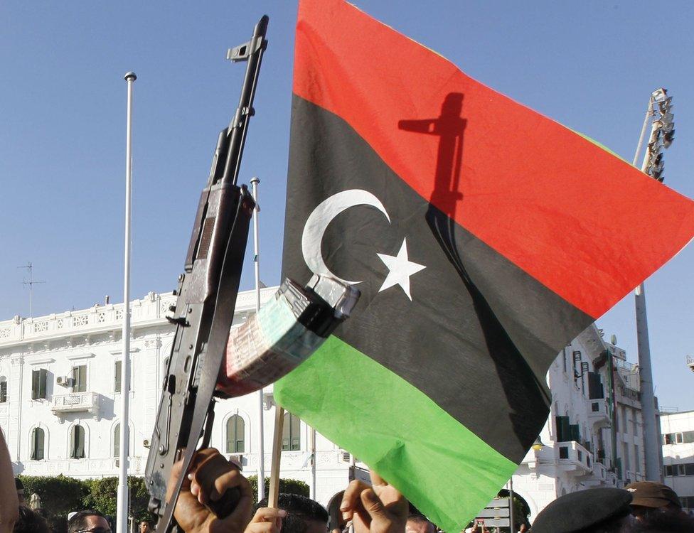 Libyan flag with gun