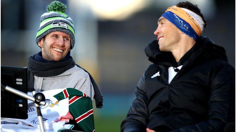 Ex-Leeds Rhinos rugby league player Kevin Sinfield (R) speaks with former teammate Rob Burrow after completing his Extra Mile Challenge at Emerald Headingley Stadium on November 23, 2021 in Leeds, England