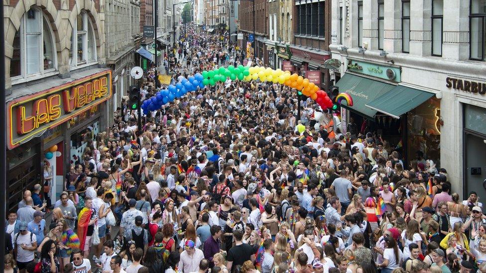 Members of the Lesbian, Gay, Bisexual and Transgender (LGBT) community take part in the annual Pride Parade in London