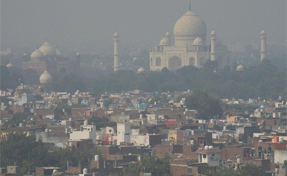 A general view shows the Taj Mahal amid smoggy conditions in Agra on October 25, 2023.