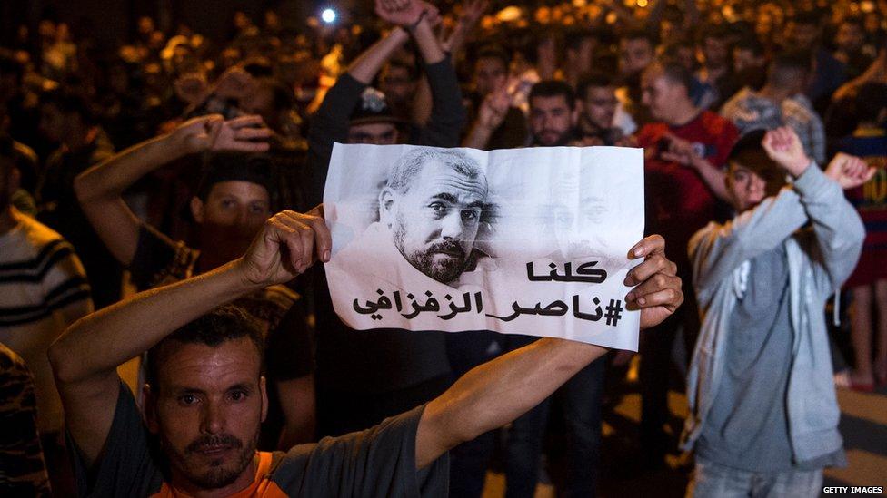 Protesters holding an image of Zefzafi