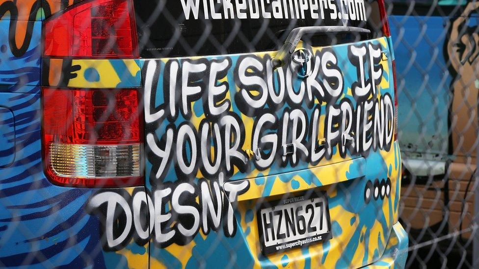 A message on a vehicle reads: "Life sucks if your girlfriend doesn't ...."