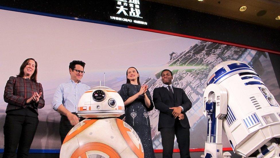 Producer Kathleen Kennedy, director J.J. Abrams, actress Daisy Ridley and actor John Boyega on stage at a press conference in Shanghai, China