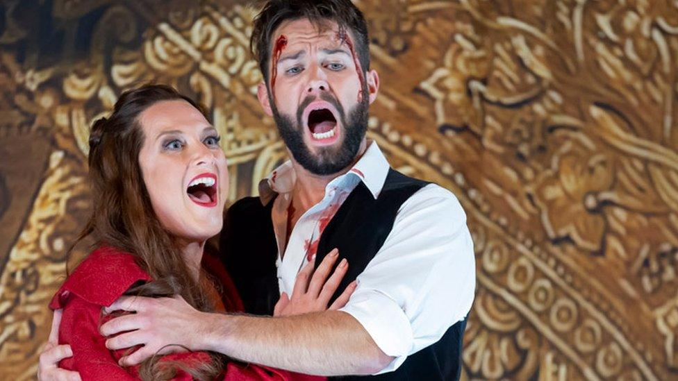 Sinead Campbell-Wallace as Floria Tosca and Adam Smith as Matio Scarpia perform onstage during a production of Tosca by Giacmo Puccini at London Coliseum on September 28, 2022 in London, England.