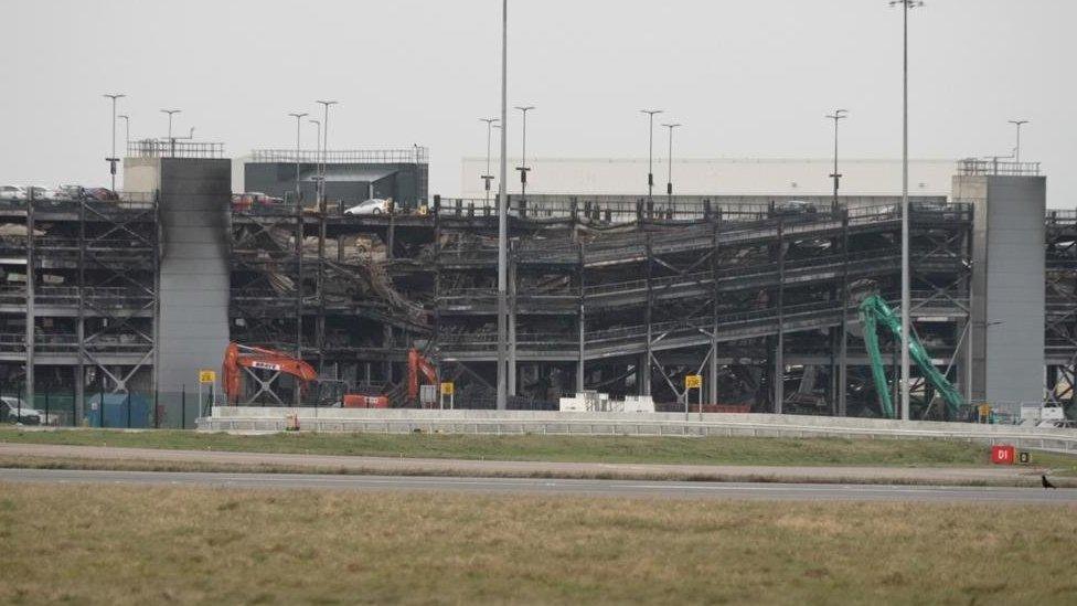 Cranes dismantle the car park