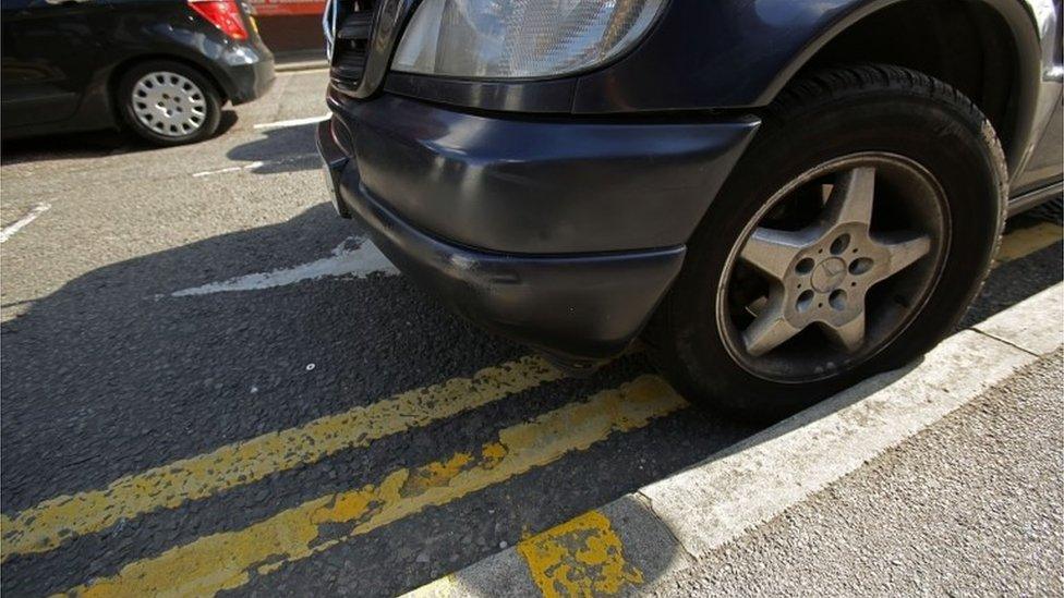 Car parked on double yellow lines