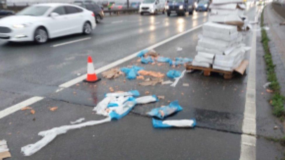 Lanes on the M6 with fish debris scattered across the carriageway