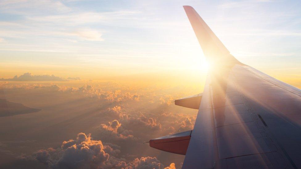 Passenger jet above the clouds