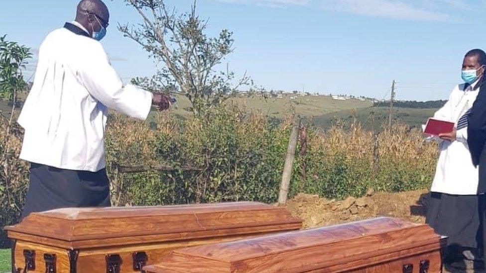 Priest presiding over a funeral