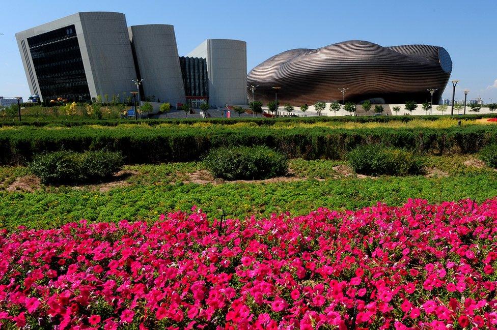 A general view shows the City Library (left) and the Ordos Museum building in the city centre of Ordos