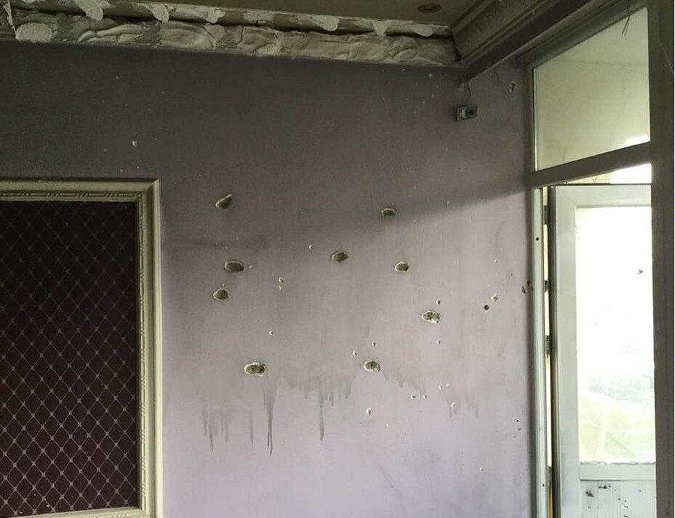 Bullet holes in the walls of a room at the Intercontinental Hotel