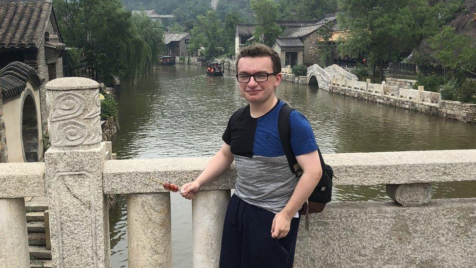 Mark posing by a river