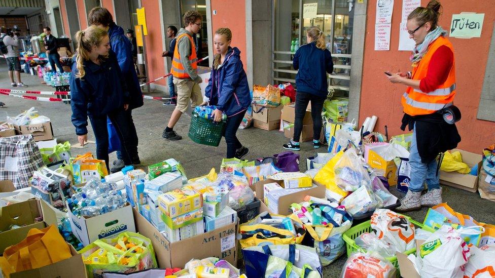 Helpers sort through aid that has been donated for migrants at Munich"s central railway station in Munich, Germany, 02 September 2015.