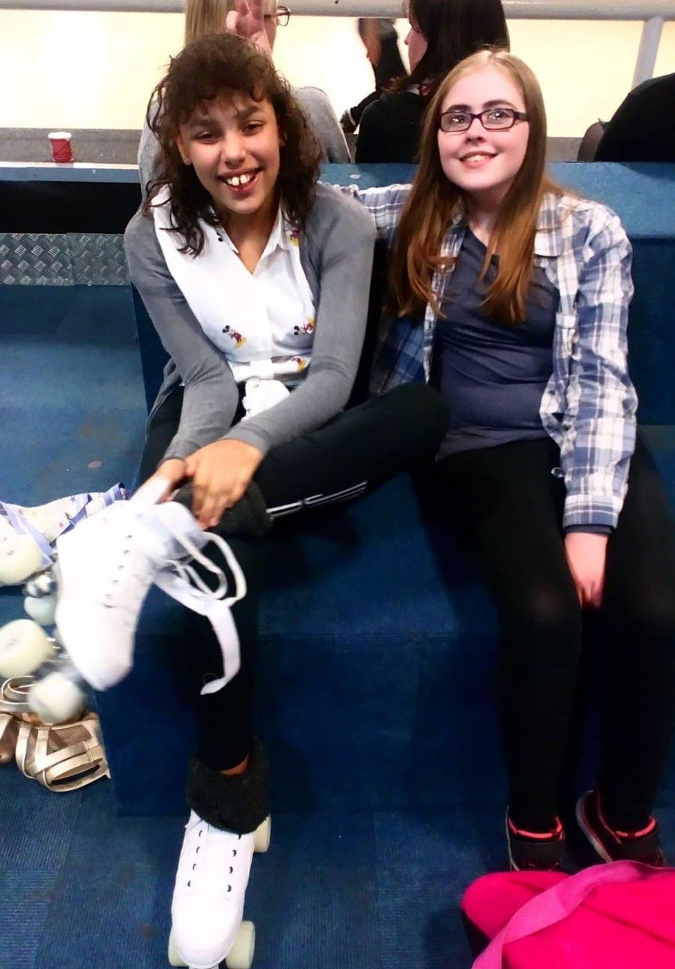 Giorgia and a friend at a roller rink