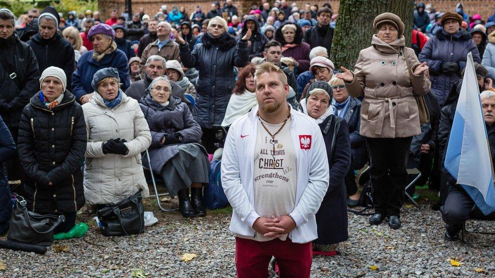 People pray on Poland's eastern border with Belarus