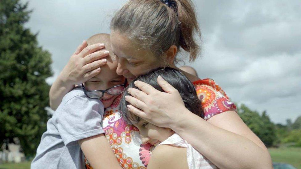 Olga reunited with two of her adopted children