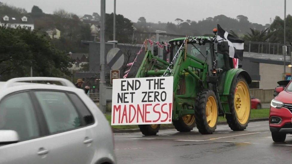 Tractor with sign on front saying 'End the net zero madness'