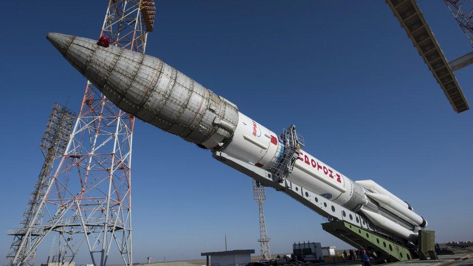 A Proton rocket is lifted on the launchpad at the Baikonur cosmodrome, Kazakhstan