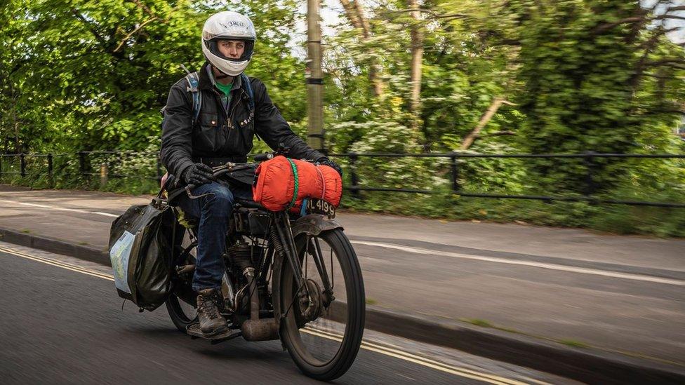 Harry Bott riding his vintage motorbike