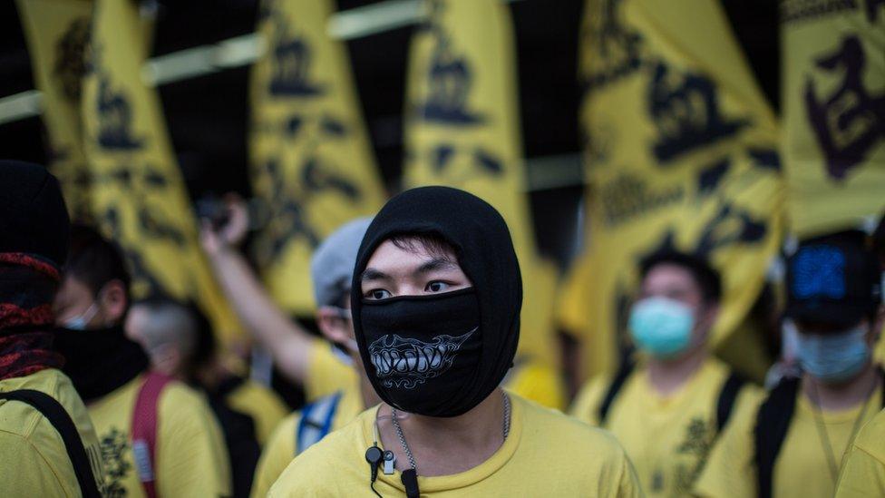 A member of the Civic Passion group looks on as he and other members attend an anti-parallel trading protest in the Yuen Long district of Hong Kong on March 1, 2015