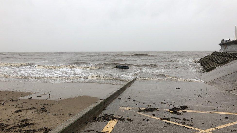 Car stranded on Starr Gate beach