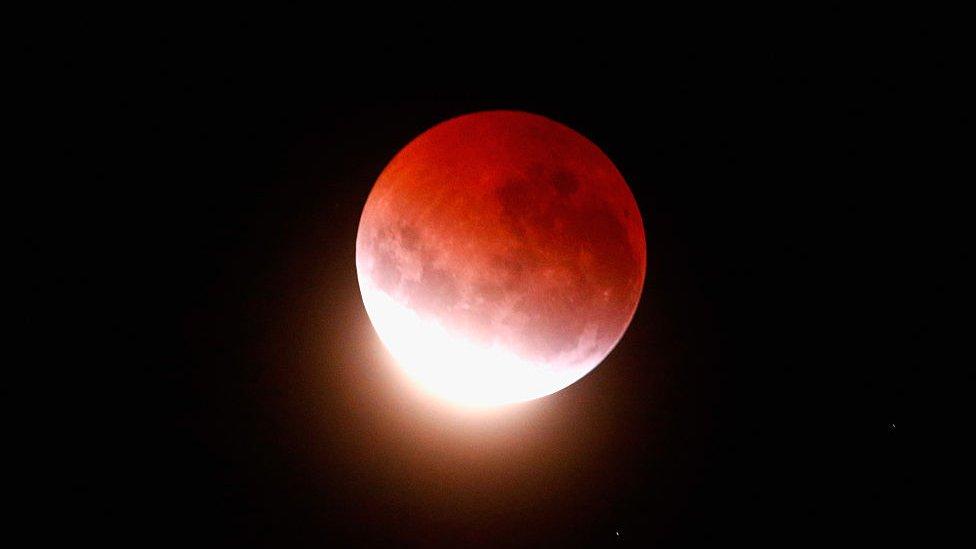 the moon glows red